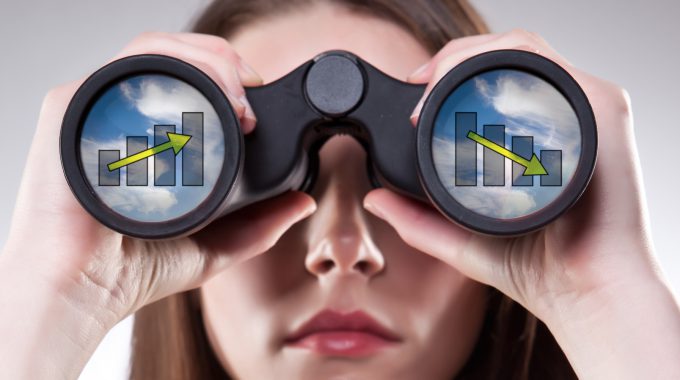 A Businesswoman Looking Through Binoculars, Seeing Conflicting Trends In Earnings Prediction, Can Be Used For Business Vision Or Business Prediction Concept